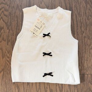 White Sleeveless Top with Bows